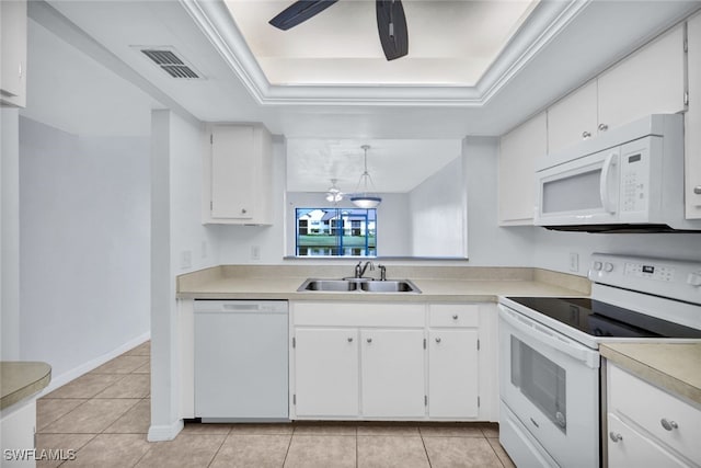 kitchen with sink, a raised ceiling, decorative light fixtures, white appliances, and white cabinets