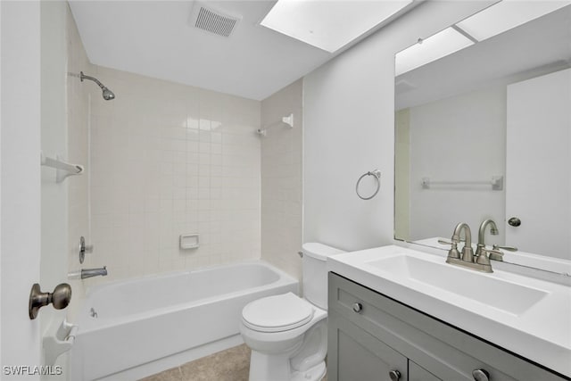 full bathroom with tile patterned flooring, vanity, toilet, and tiled shower / bath