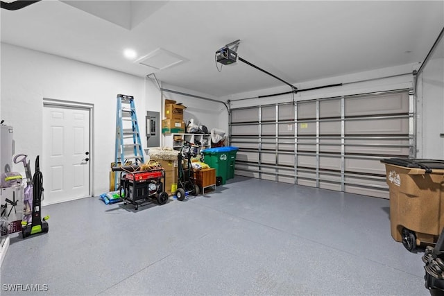 garage with electric panel and a garage door opener