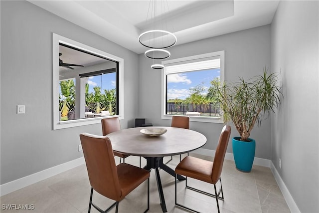 dining space with plenty of natural light and ceiling fan