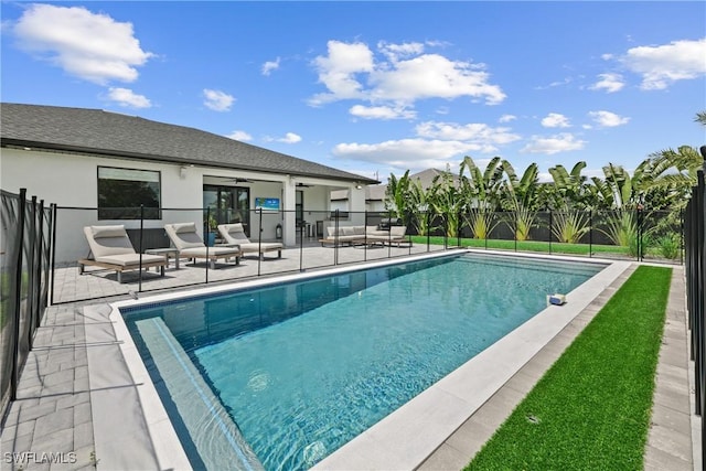 view of pool featuring ceiling fan and a patio