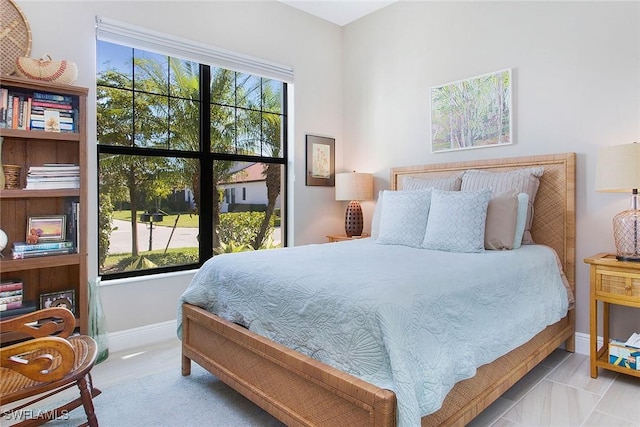 bedroom featuring multiple windows