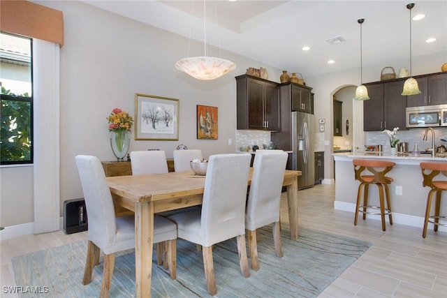 dining space with light hardwood / wood-style floors