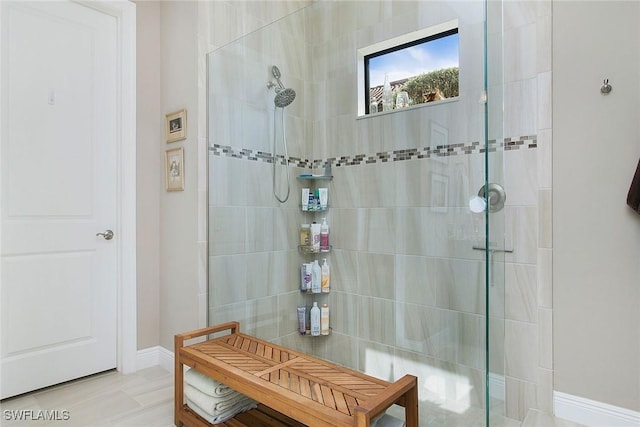 bathroom featuring a tile shower