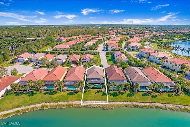 birds eye view of property with a water view