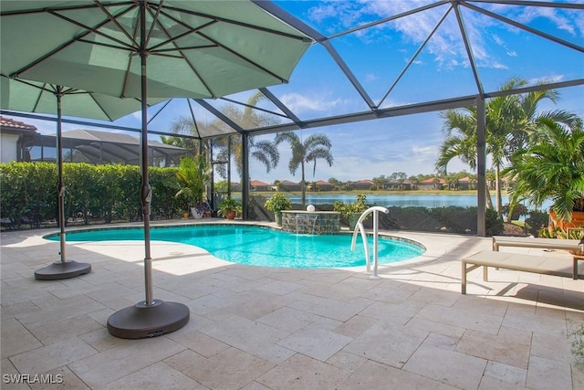 view of swimming pool featuring pool water feature, a patio, a water view, and glass enclosure