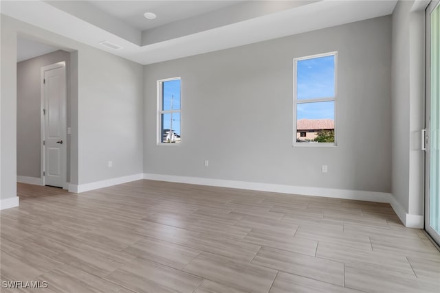 empty room with light hardwood / wood-style flooring