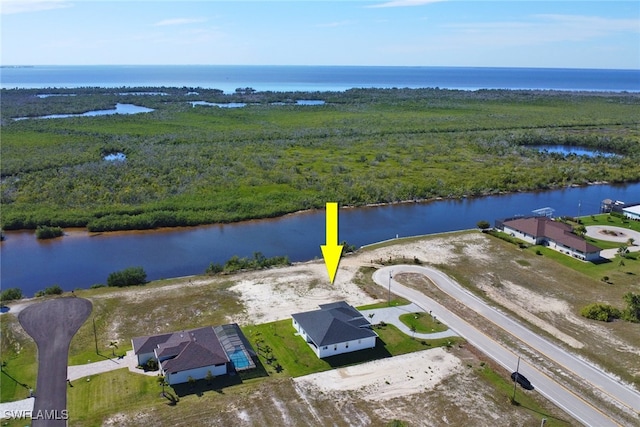 birds eye view of property featuring a water view