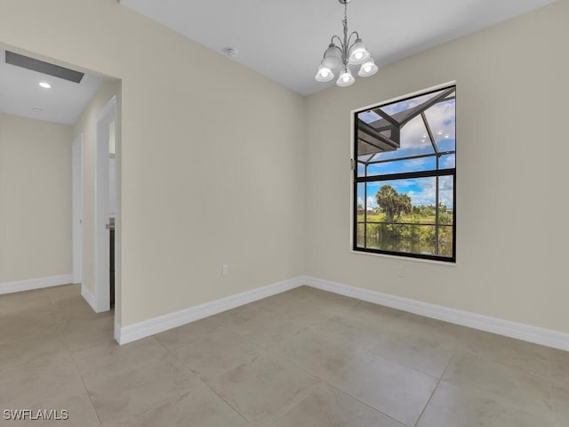 unfurnished room featuring a notable chandelier and light tile patterned floors