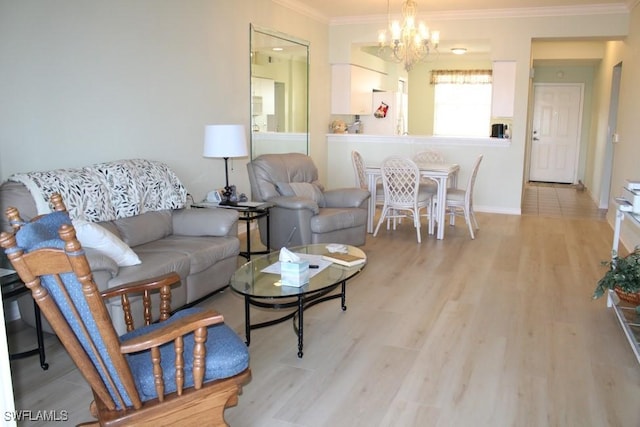 living room with crown molding, light hardwood / wood-style flooring, and a notable chandelier