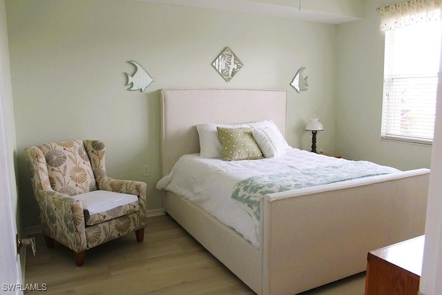 bedroom with light wood-type flooring