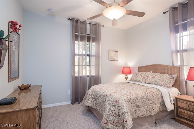 bedroom featuring ceiling fan and light colored carpet