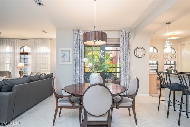 dining space with light tile patterned flooring