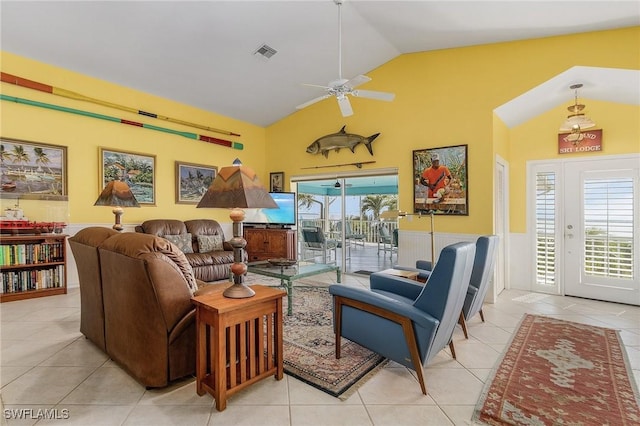 living room with ceiling fan, plenty of natural light, light tile patterned floors, and high vaulted ceiling