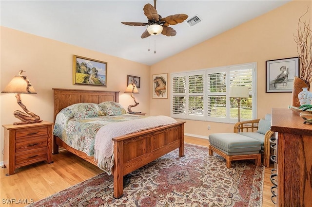 bedroom with wood-type flooring, vaulted ceiling, and ceiling fan