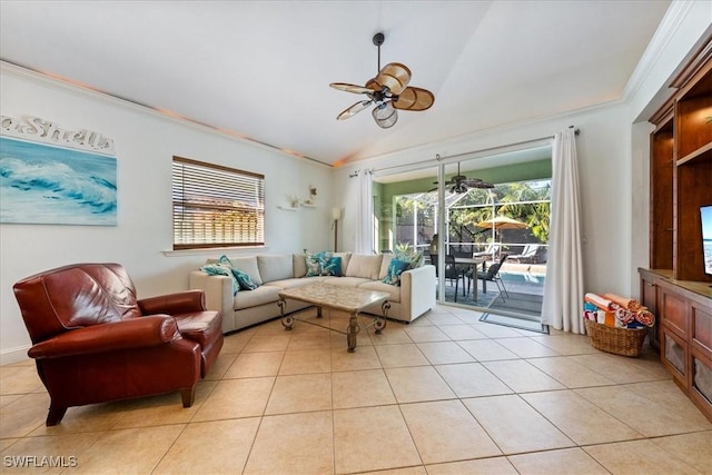 living room with ceiling fan, crown molding, light tile patterned floors, and lofted ceiling