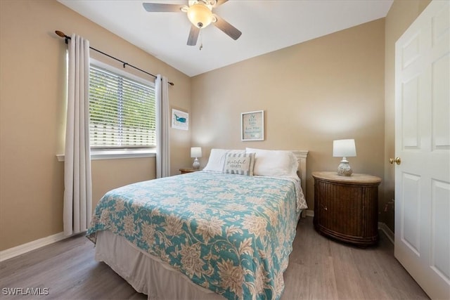 bedroom featuring ceiling fan and light hardwood / wood-style flooring