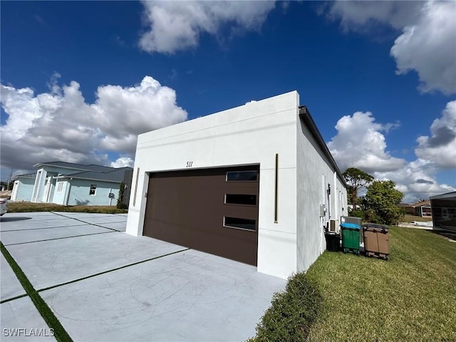 garage featuring a yard