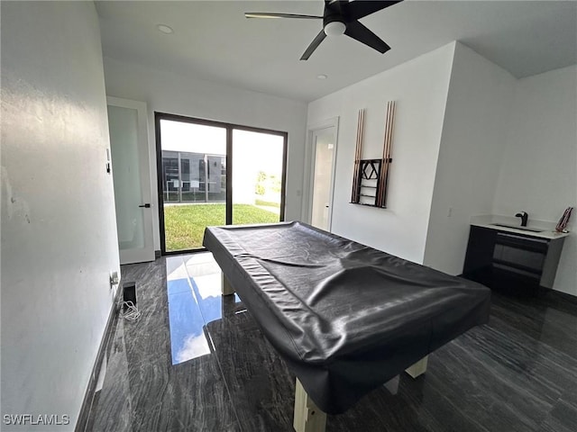 rec room with ceiling fan, dark hardwood / wood-style flooring, and billiards