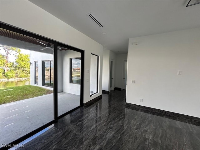 unfurnished room featuring ceiling fan