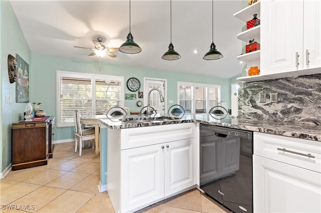 kitchen with white cabinetry, sink, dark stone counters, and black dishwasher