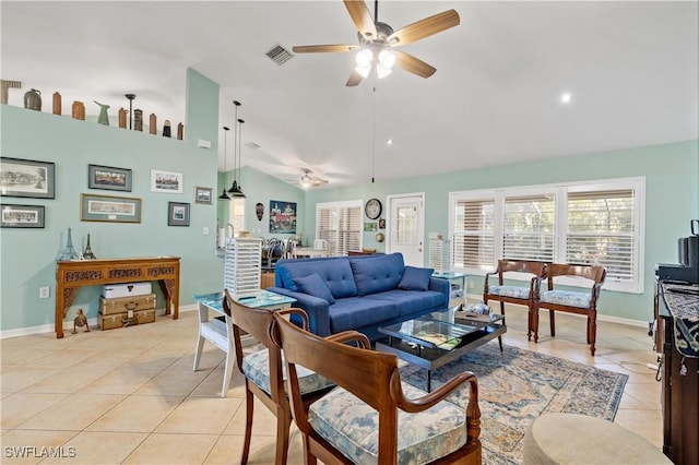 tiled living room featuring ceiling fan and lofted ceiling