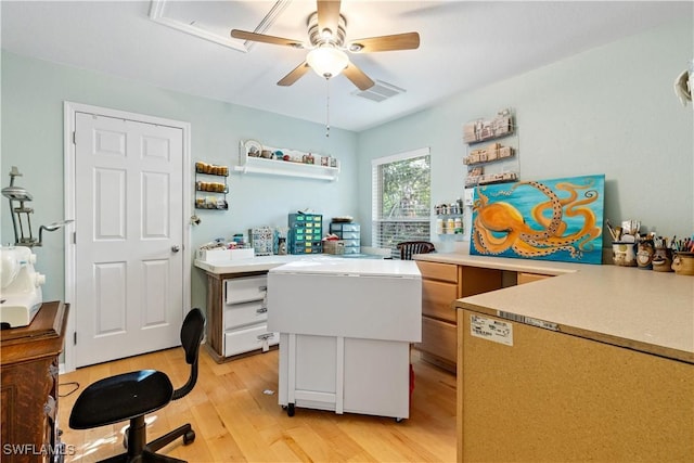 office area with ceiling fan and light hardwood / wood-style floors