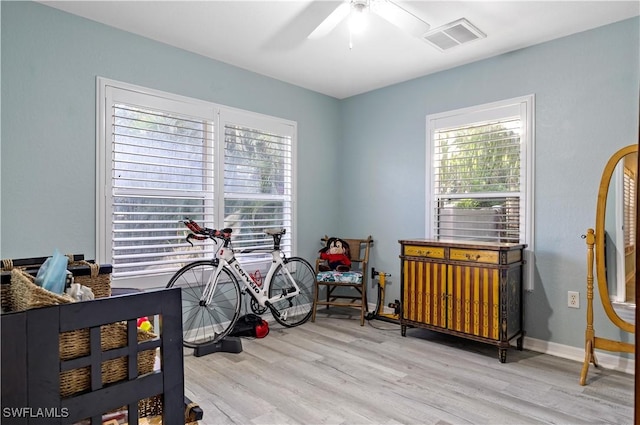 bedroom with ceiling fan and light wood-type flooring