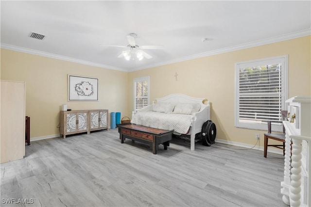 bedroom with ceiling fan, light hardwood / wood-style floors, and ornamental molding