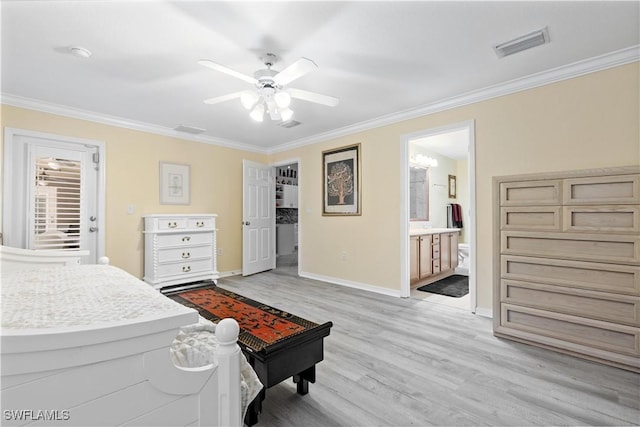 bedroom featuring light wood-type flooring, ensuite bath, ceiling fan, and ornamental molding