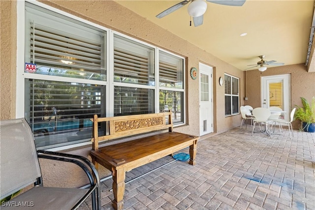 view of patio / terrace featuring ceiling fan