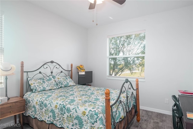 bedroom with hardwood / wood-style flooring and ceiling fan