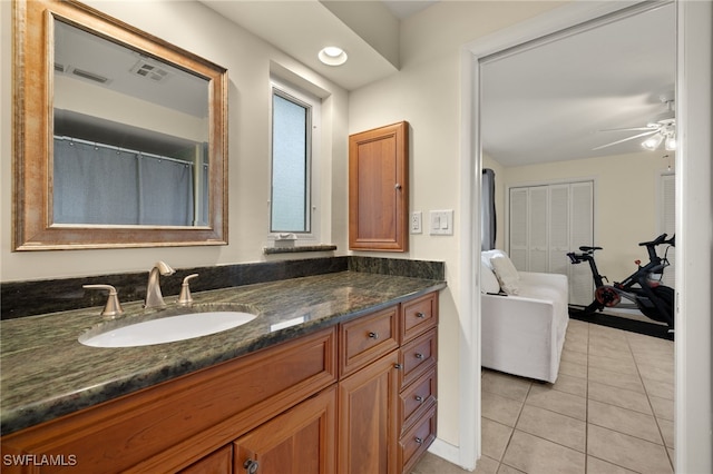 full bathroom featuring ceiling fan, visible vents, vanity, and tile patterned floors