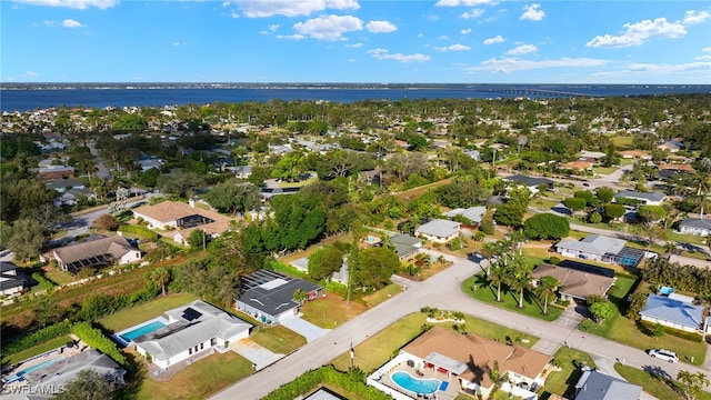 bird's eye view with a water view and a residential view