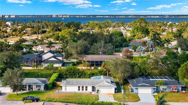 birds eye view of property featuring a water view and a residential view