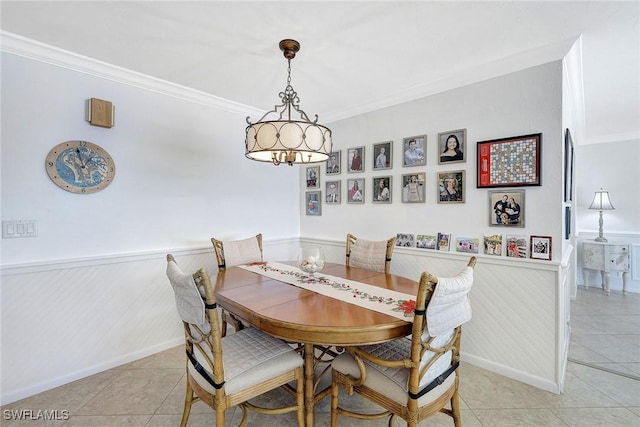 tiled dining room with ornamental molding