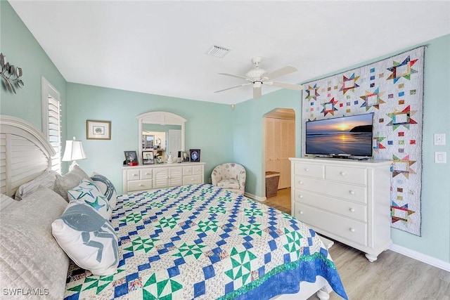 bedroom with ceiling fan and light hardwood / wood-style flooring