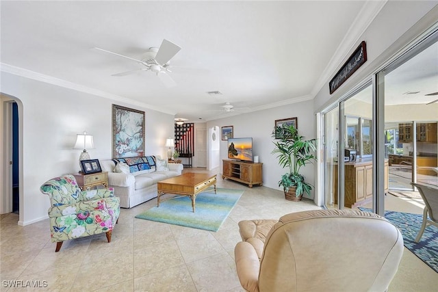 living room with ceiling fan, crown molding, and light tile patterned flooring