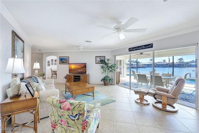 tiled living room featuring crown molding and ceiling fan