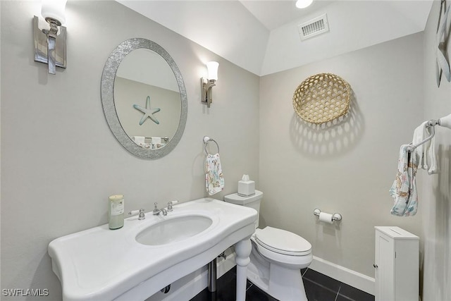 bathroom with tile patterned flooring, toilet, and sink