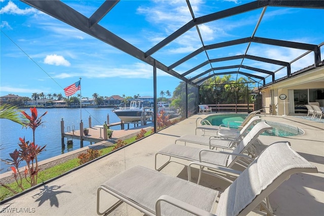 view of pool featuring a water view, a dock, a lanai, and a patio area