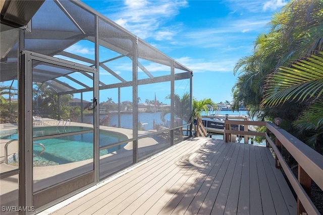 deck with a water view and a lanai