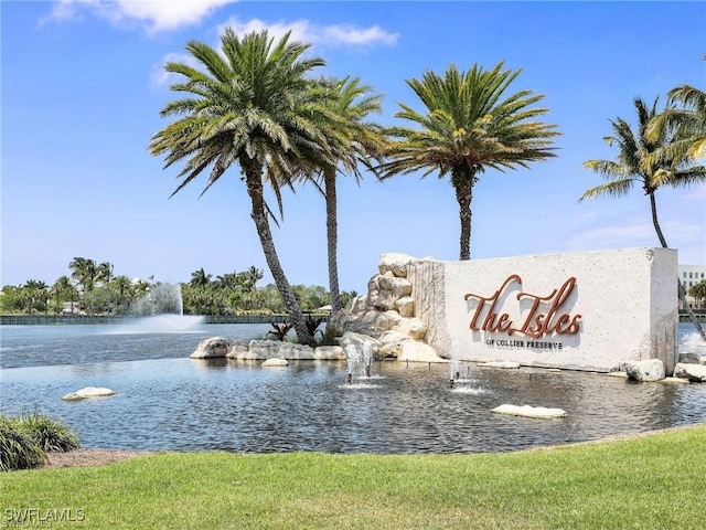 community / neighborhood sign featuring a water view