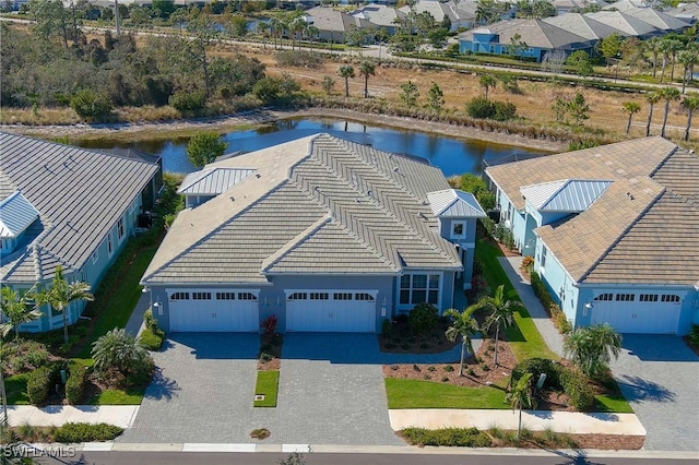 birds eye view of property featuring a water view