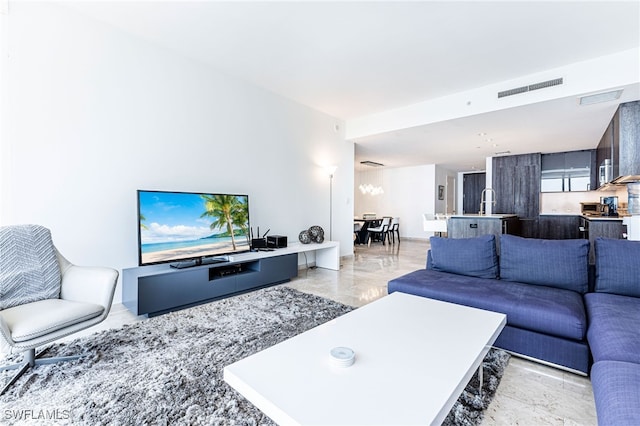 living room featuring an inviting chandelier