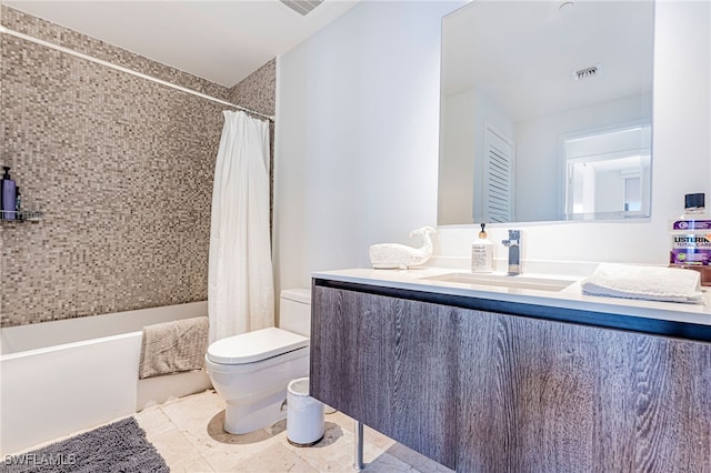 full bathroom featuring shower / bath combo with shower curtain, tile patterned flooring, vanity, and toilet