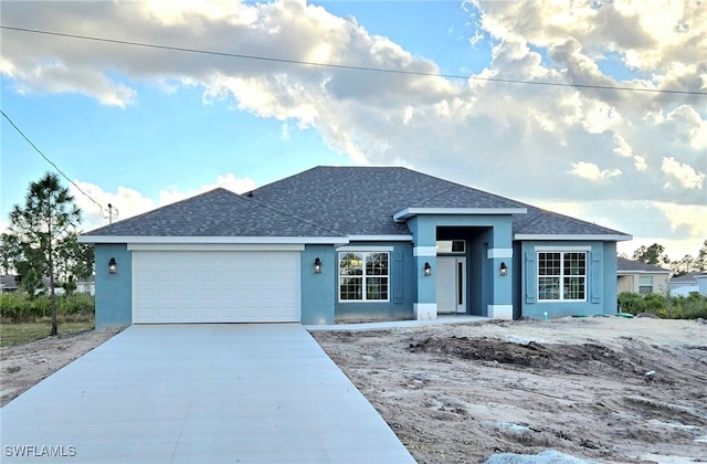 single story home featuring stucco siding, a garage, concrete driveway, and a shingled roof