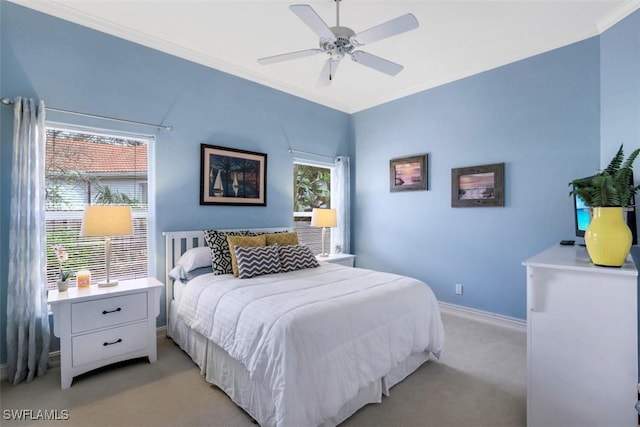 bedroom with multiple windows, ceiling fan, crown molding, and light carpet