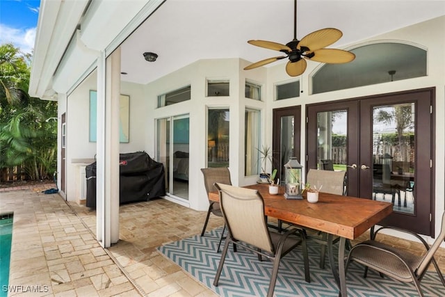 sunroom with ceiling fan and french doors