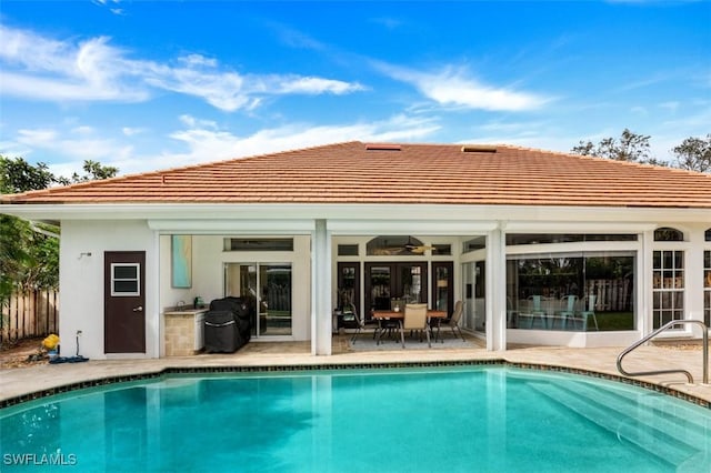 back of house with a patio area and ceiling fan